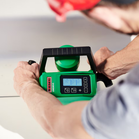 Green handheld infrared thermometer gun with digital LCD display, °C/°F scales, ergonomic pistol grip