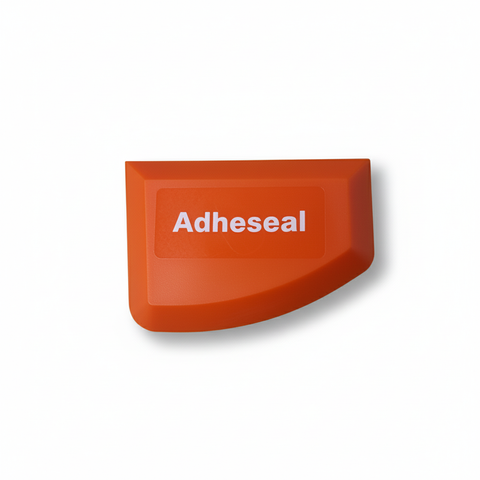 Orange Adheseal curved plastic tool for smoothing sealant and caulk finishes
